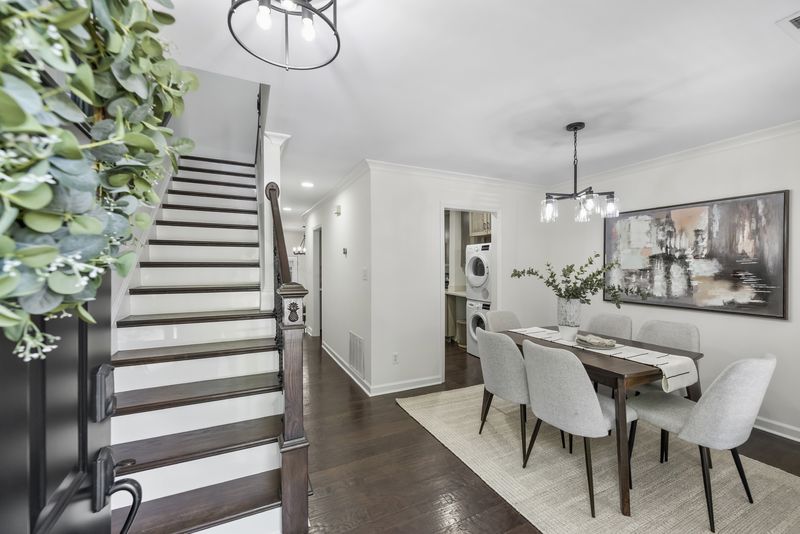 Entry foyer with the staircase and dining area