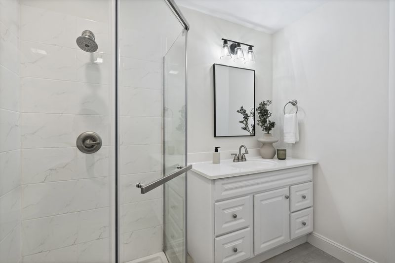 Full bath with a glass walk-in shower