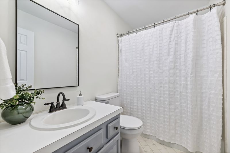 Full bath with a vanity and tub-shower