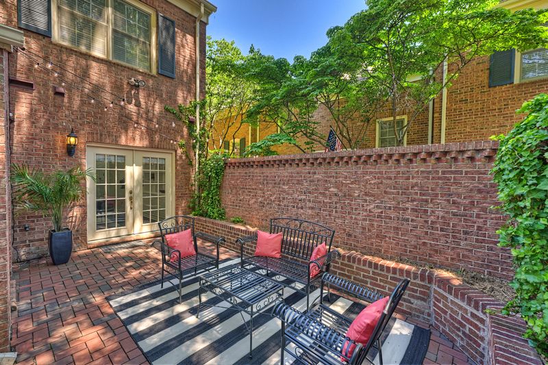 Private brick courtyard with bistro seating